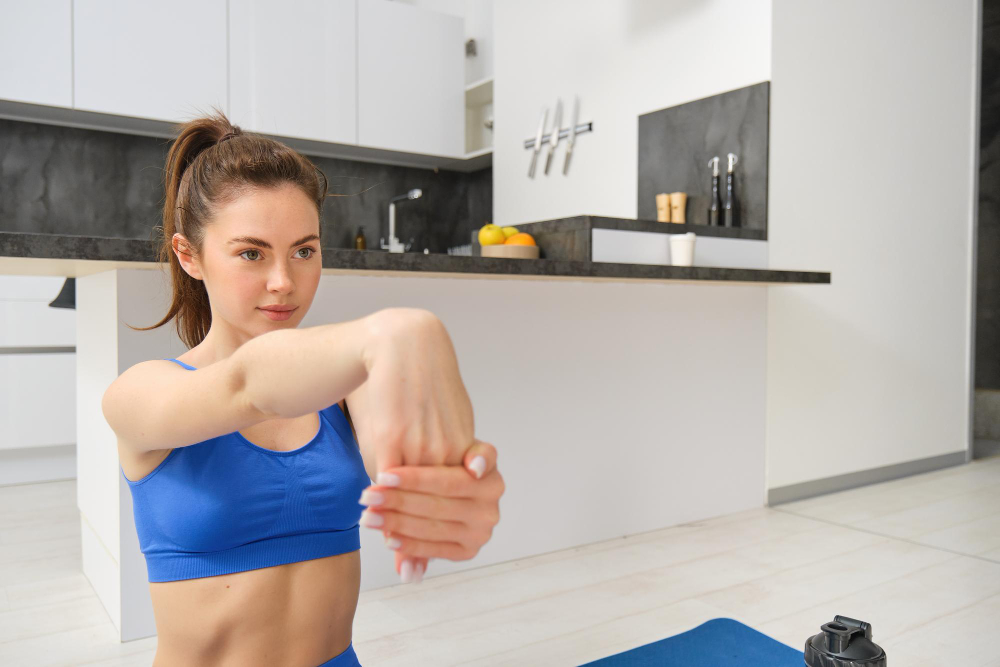 Woman stretching her arms comfortably at home